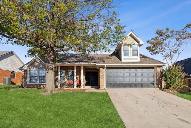 view of front of house with a front yard, a garage, and central AC unit