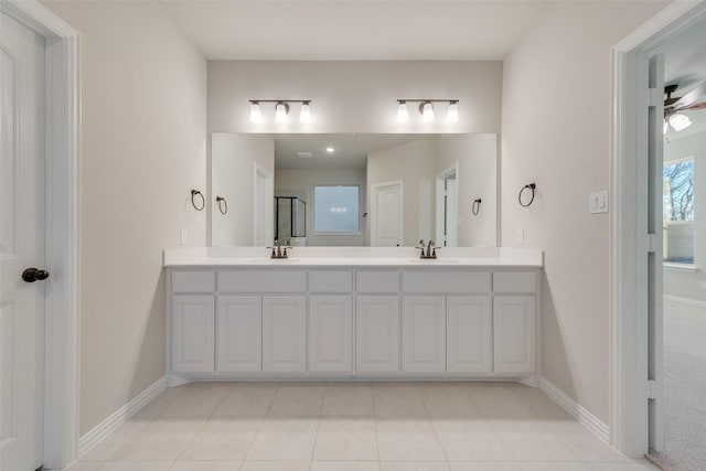 bathroom featuring ceiling fan, tile patterned flooring, and vanity