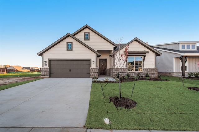 craftsman-style home featuring a front yard and a garage