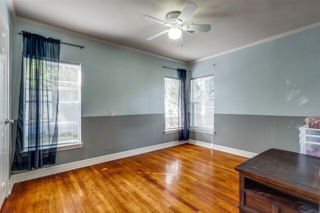 interior space with ceiling fan, plenty of natural light, and hardwood / wood-style floors