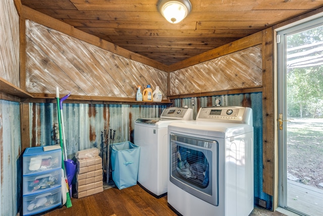 laundry room featuring washing machine and clothes dryer, wood ceiling, and dark wood-type flooring