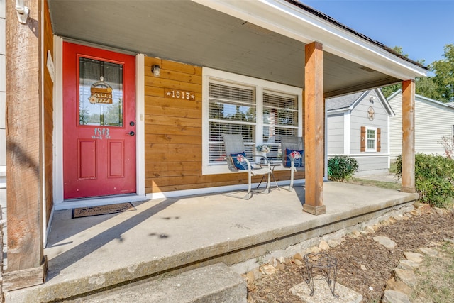 property entrance featuring covered porch