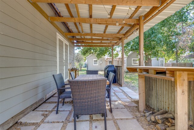 view of patio / terrace featuring a shed