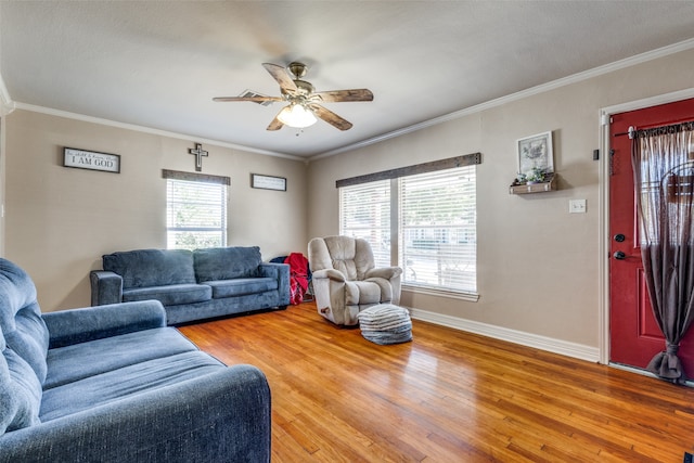 living room with ornamental molding, a wealth of natural light, and wood-type flooring