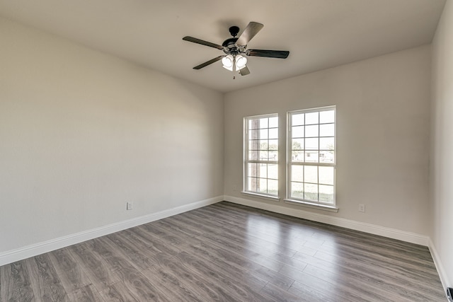 empty room featuring ceiling fan and hardwood / wood-style flooring