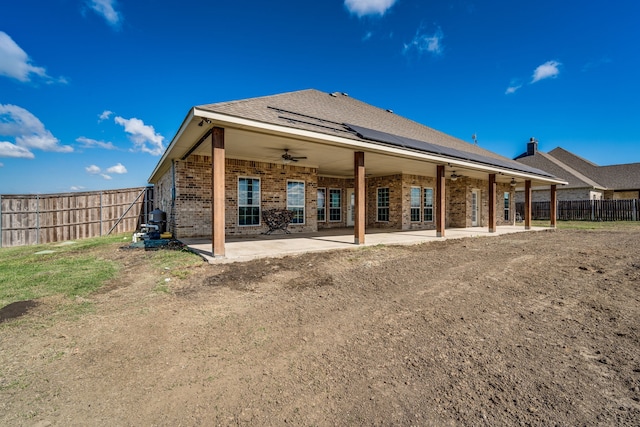 back of property with a patio and ceiling fan