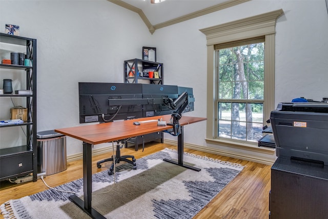 office space with vaulted ceiling, hardwood / wood-style floors, and crown molding