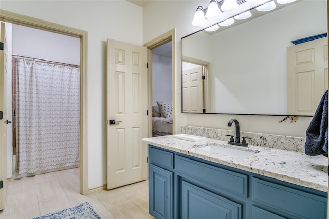 bathroom with tile patterned flooring, vanity, and a shower with curtain