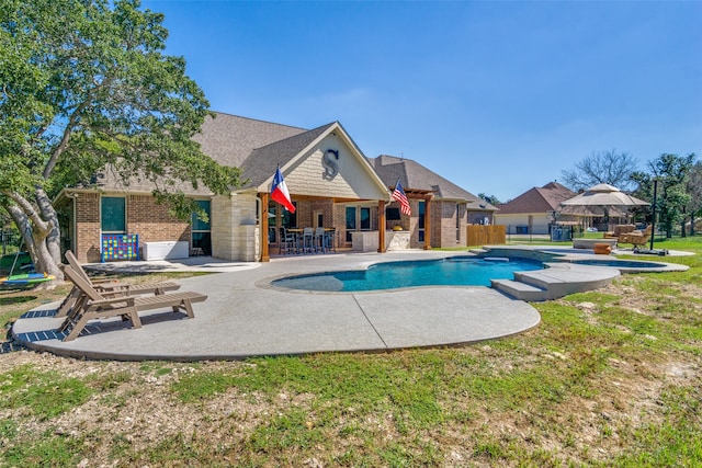 view of pool featuring a patio, a gazebo, and a yard