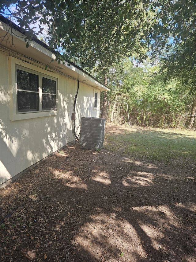 view of yard with central AC unit