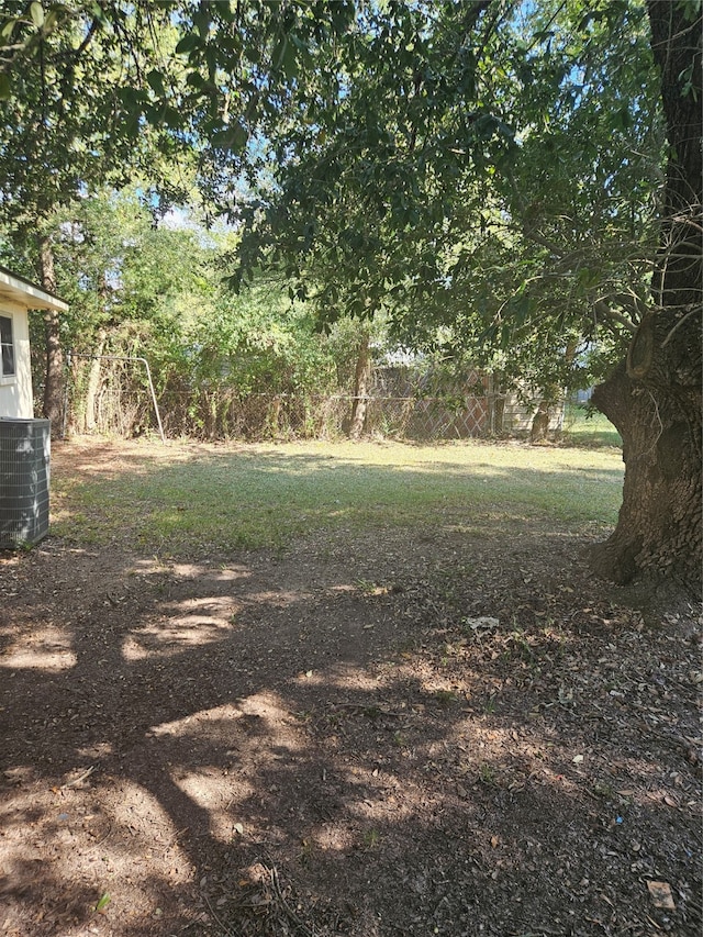 view of yard featuring central AC unit