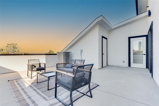 view of patio terrace at dusk