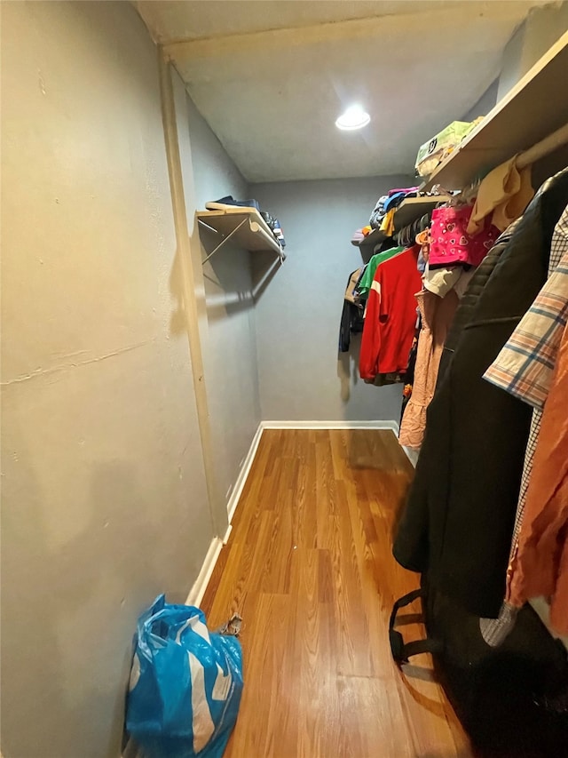 spacious closet featuring hardwood / wood-style flooring