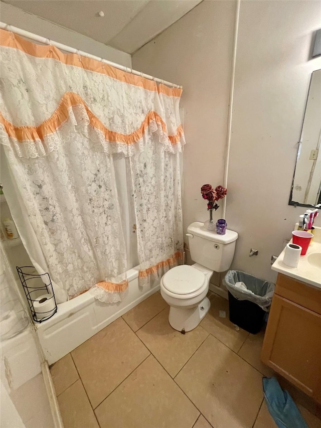2554 Lamar St, Bossier City, LA 71112 - full bathroom featuring tile patterned flooring, shower / bath combo with shower curtain, vanity, and toilet