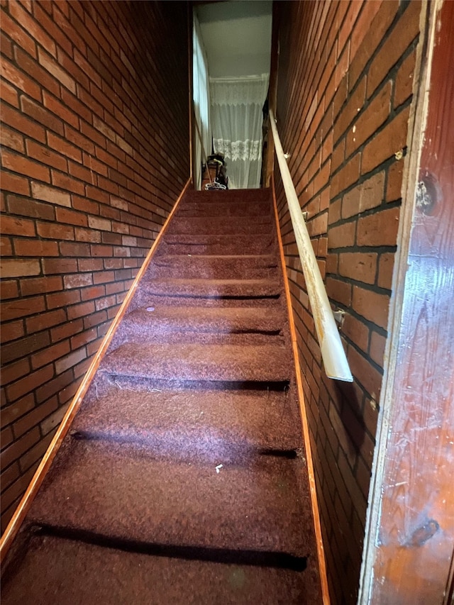 stairway with brick wall