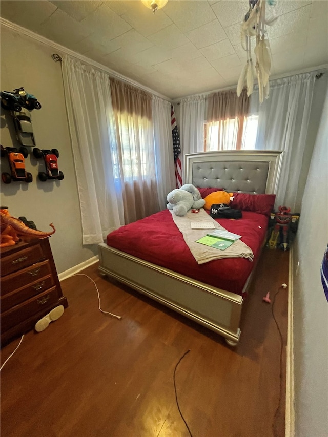 bedroom featuring wood-type flooring