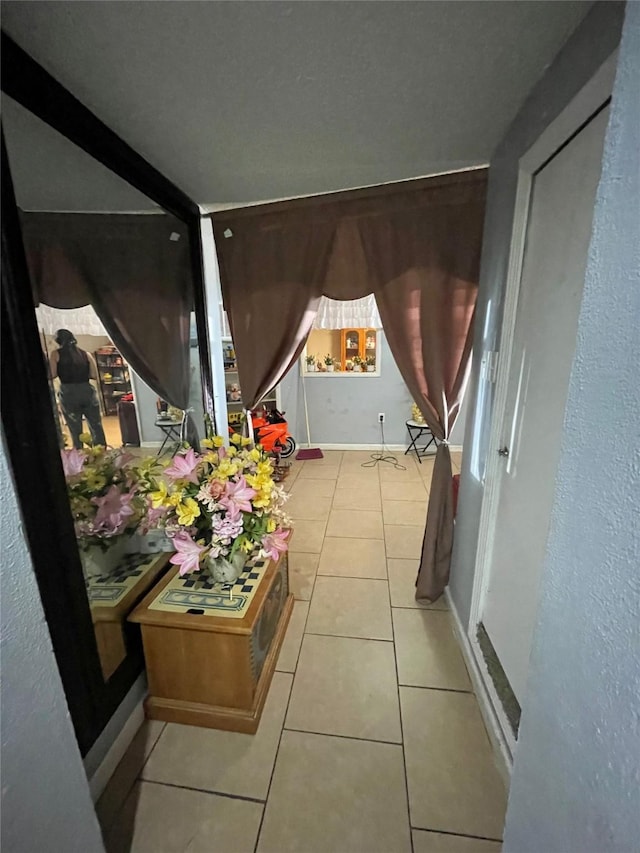 2554 Lamar St, Bossier City, LA 71112 - corridor with tile patterned floors and baseboards