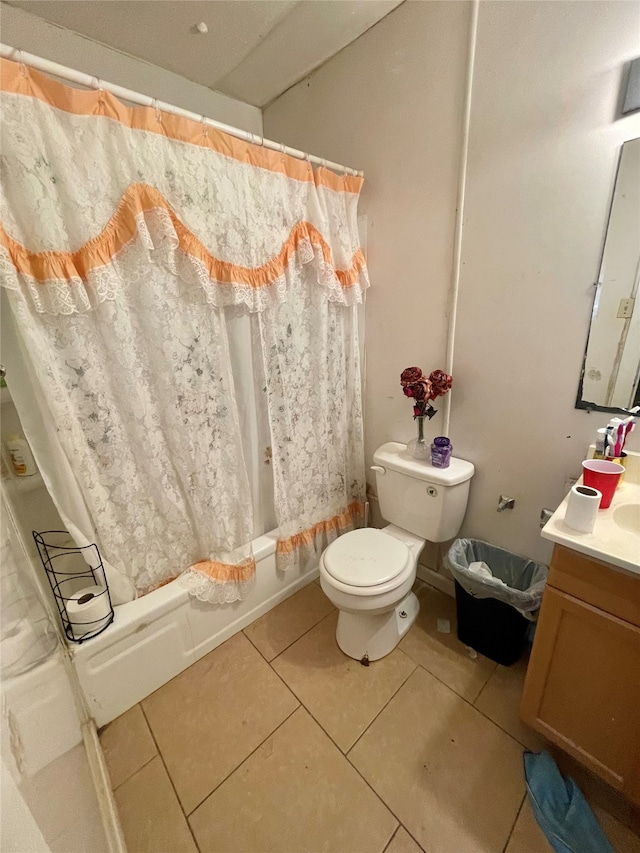 full bathroom featuring toilet, tile patterned floors, shower / tub combo, and vanity