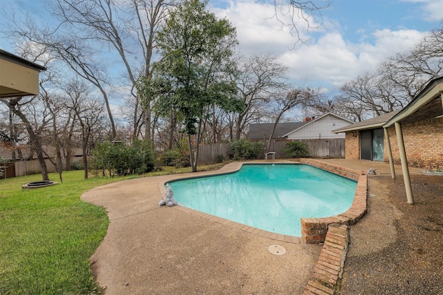 view of pool featuring a yard and a patio area