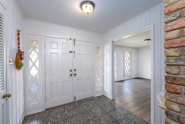 entrance foyer featuring crown molding