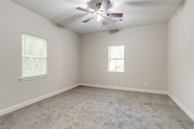 unfurnished room with light carpet and ceiling fan