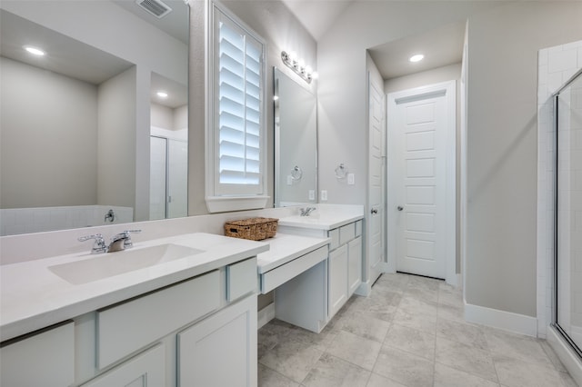 bathroom featuring vanity and a shower with shower door