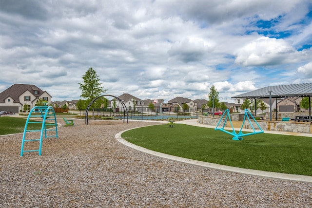 view of playground with a gazebo and a lawn