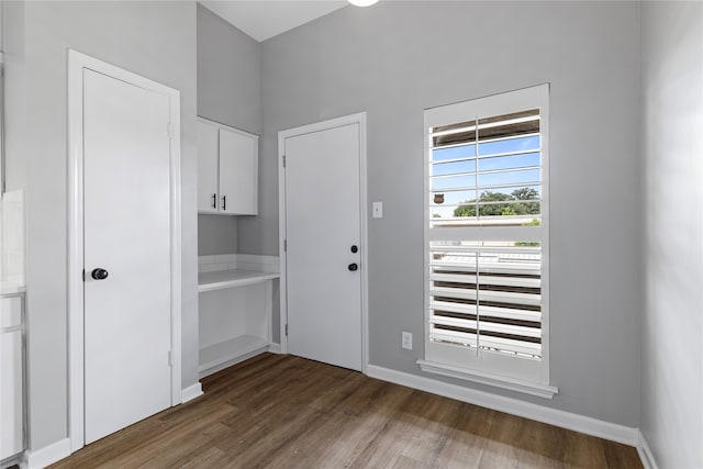 doorway to outside with wood-type flooring