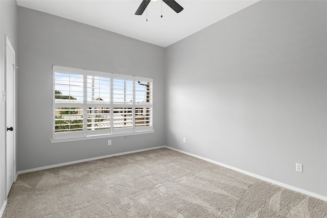 spare room with carpet floors and ceiling fan