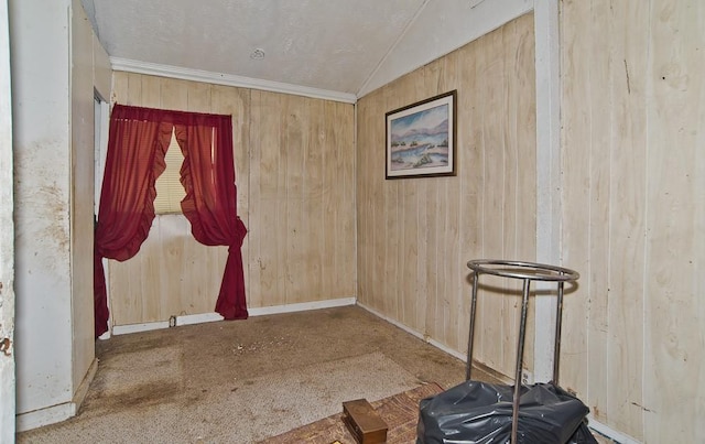 2223 Marburg St, Dallas, TX 75215 - empty room with baseboards, crown molding, vaulted ceiling, and wooden walls