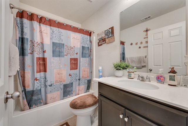 full bathroom with vanity, shower / bath combo with shower curtain, toilet, and tile patterned floors