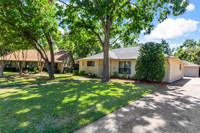 ranch-style home with a garage and a front lawn