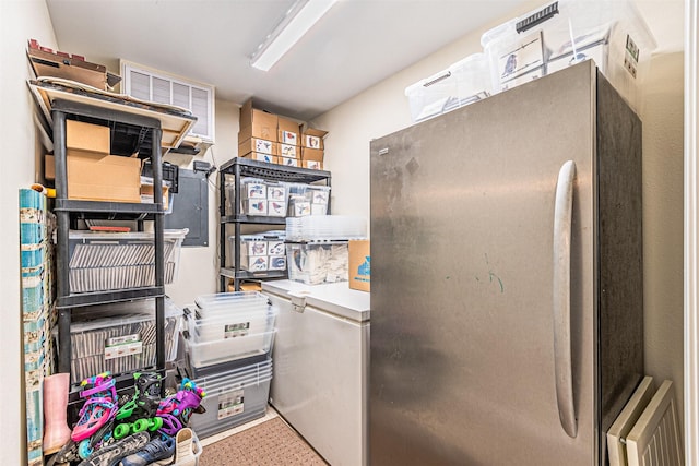 kitchen with freestanding refrigerator