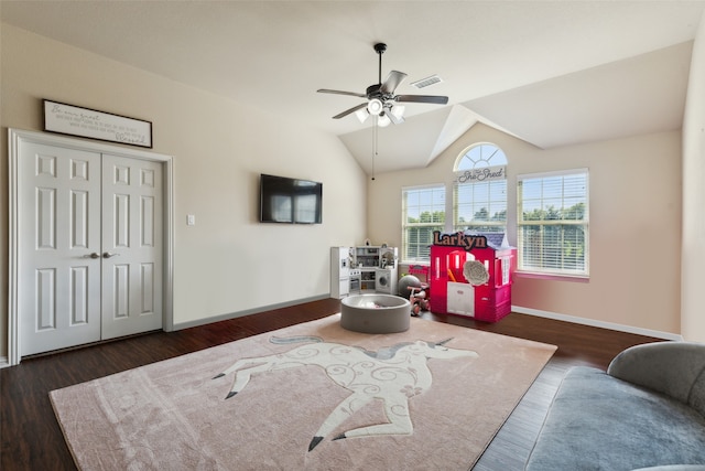 playroom with lofted ceiling, dark hardwood / wood-style floors, and ceiling fan