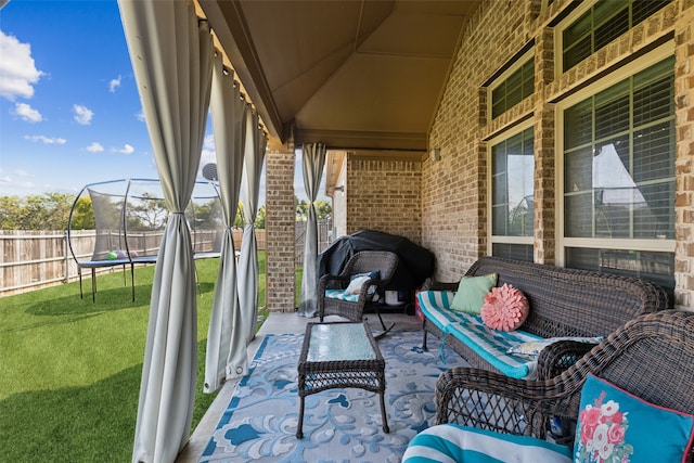 view of patio featuring outdoor lounge area and a trampoline