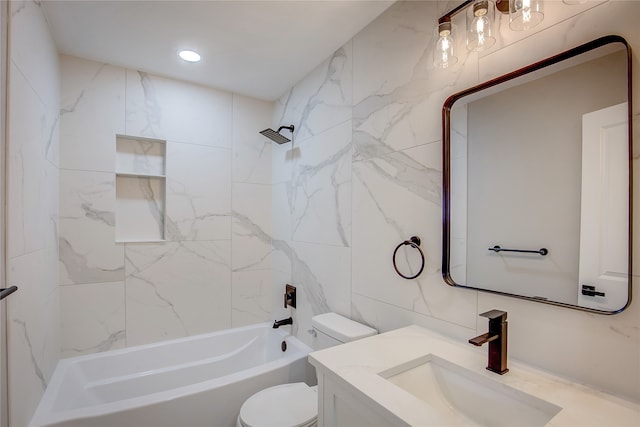 full bathroom featuring toilet, vanity, tile walls, and tiled shower / bath