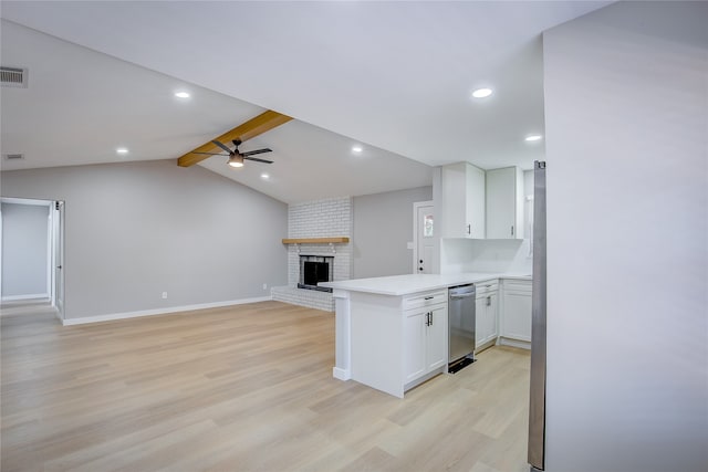 kitchen with white cabinetry, ceiling fan, stainless steel dishwasher, lofted ceiling with beams, and kitchen peninsula