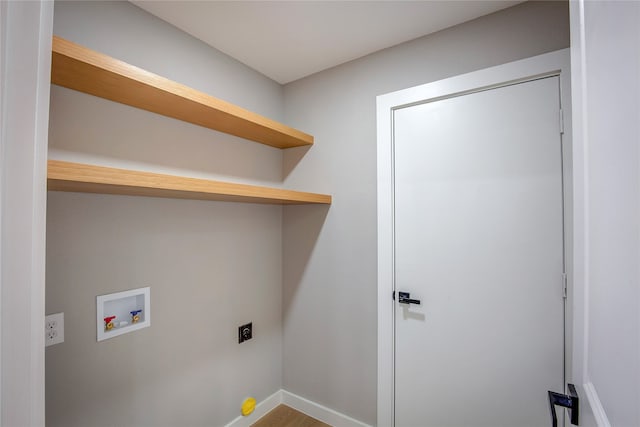 laundry room featuring hardwood / wood-style flooring, electric dryer hookup, and hookup for a washing machine