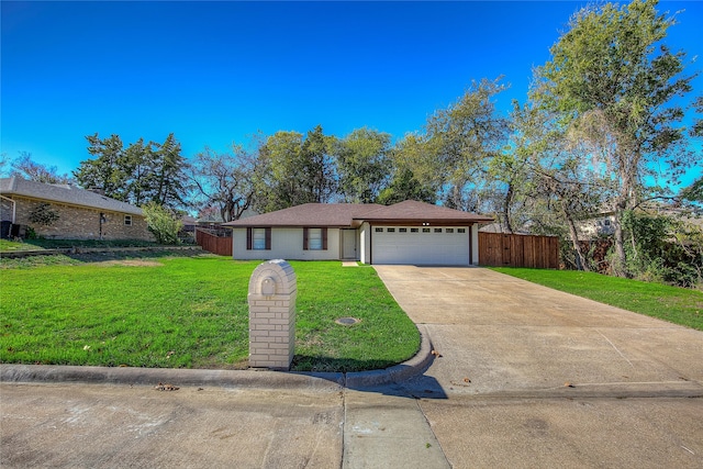 ranch-style house featuring a garage and a front lawn