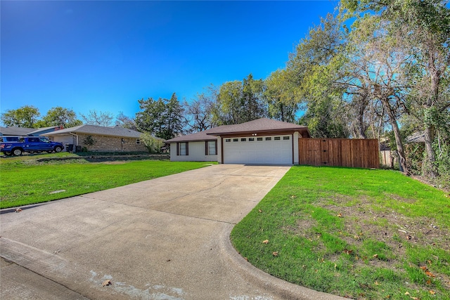 ranch-style home with a front lawn and a garage