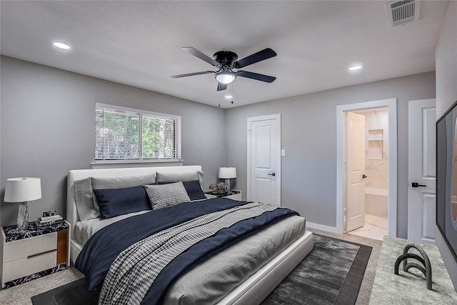 bedroom featuring ensuite bathroom and ceiling fan