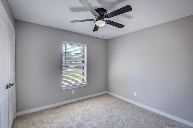 unfurnished room with carpet flooring and ceiling fan