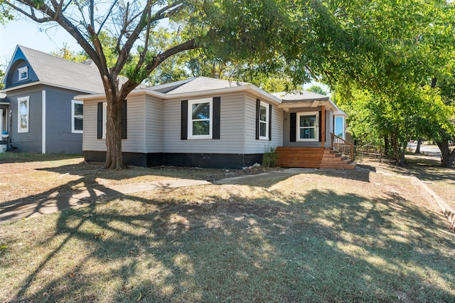 single story home with a front yard