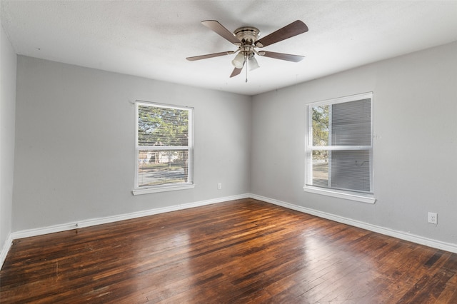 spare room featuring ceiling fan, a textured ceiling, and dark hardwood / wood-style floors