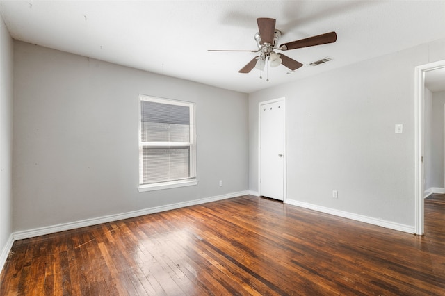 unfurnished room featuring ceiling fan and dark hardwood / wood-style floors