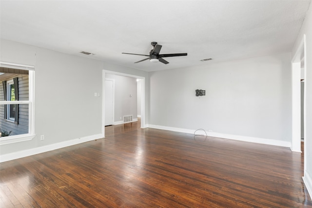 spare room featuring ceiling fan and dark hardwood / wood-style flooring