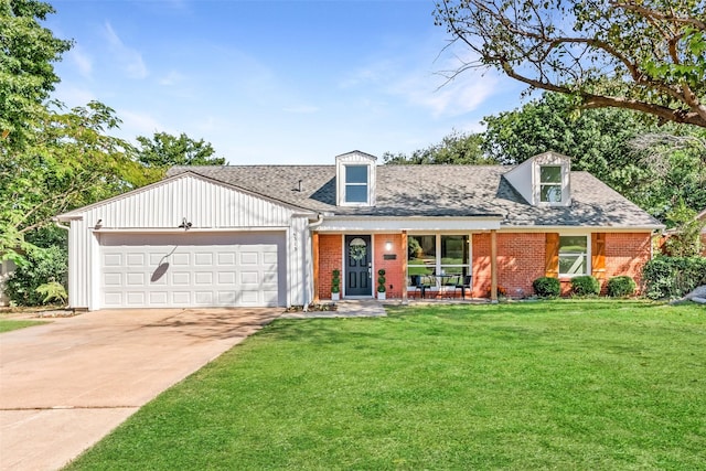 view of front of property featuring a garage and a front lawn