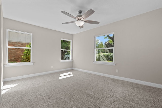 carpeted empty room with ceiling fan