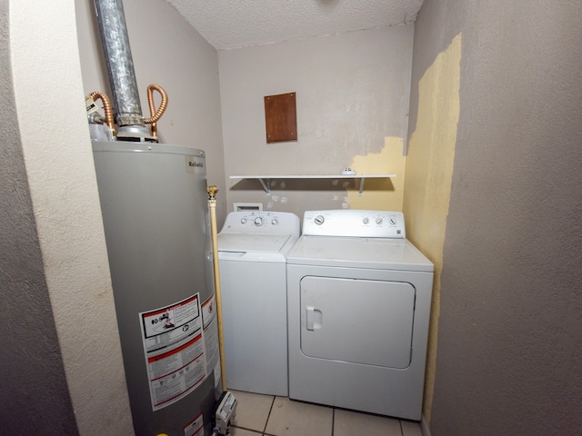 laundry area with gas water heater, a textured ceiling, light tile patterned floors, and washing machine and clothes dryer