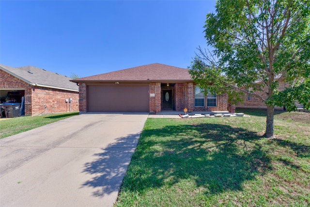 single story home featuring a front yard and a garage